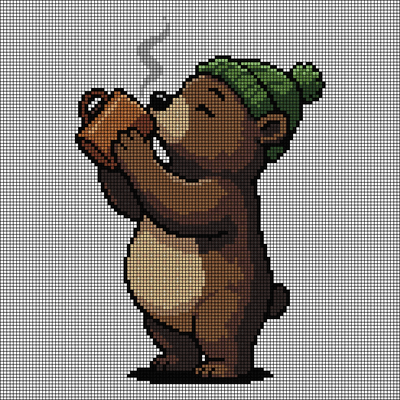 Cross-stitch pattern of a brown bear cub in a green pom-pom beanie drinking from a steaming brown mug